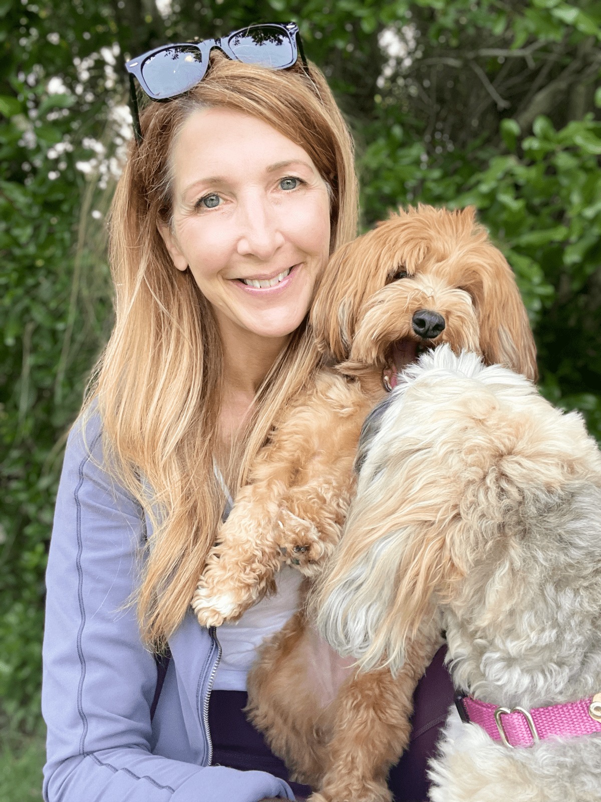 woman with two small dogs