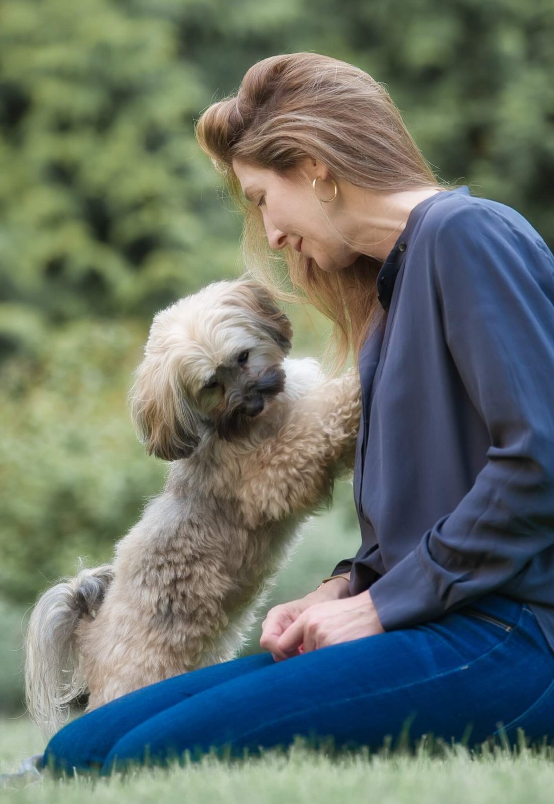 Small dog Phoebe standing with mom Karen Izzo